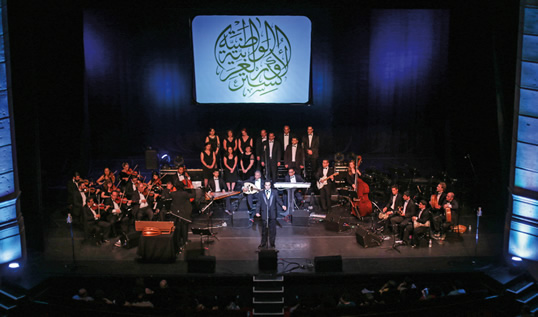 “It was my goal from the beginning to have a full-time professional orchestra and to also build a school for Arabic music,” says Ibrahim, below. Among three singers on the nao’s May 31 program was Aboud Agha, above, who first performed as a teenager in Syria.  