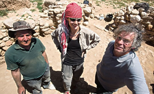 Posing amid the dig site in Beidha, from left, are archeologists Mohammed Najjar, former director of excavations at Jordan’s Department of Antiquities, Cheryl Makarewicz of Kiel University in Germany, and Bill Finlayson, regional director of the Council for British Research in the Levant. 