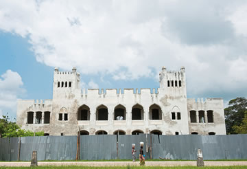 A fence keeps visitors at a distance during restoration of the 1897 headquarters of the German colonial administration. 