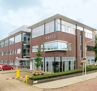Today, Brill’s second building, overlooking the Oude Rijn Canal, left, is full of apartments. In 1961, unable to accommodate its growing publishing business and the growing collections of multilingual, lead typefaces that it required, Brill moved to the outskirts of Leiden, above; the lead type was discarded in the 1980s with the digital revolution. Today, the address on Plantijnstraat—aptly named after the 16th-century printer Christoffel Plantijn—remains Brill’s head office.  