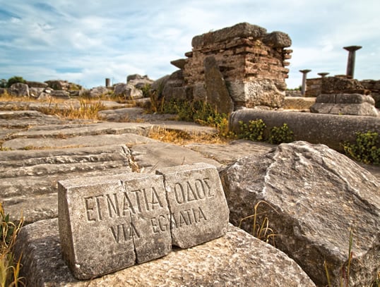 Old and new, the Via Egnatia links not only Western and Eastern empires, but also more than two millennia of history over 1,120 kilometers, witnessed by a marker found amid the ruins of Philippi, Greece.