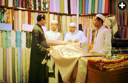 Fabric shops like this one in Saudi Arabia boast cloth including muslin and damask–which take their names from the cities where they were made: Mosul in Iraq, and Damascus in Syria.