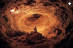 A caver in a chamber of “The Dome” in Dhal Shawyah.