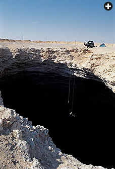 Mike Gibson rappels into the mouth of Abu al-Hol (“Father of Fear”), the fourth deepest of Saudi Arabia’s known caves.