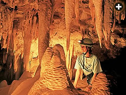 Stalactites form like icicles, but over a far longer time, stalagmites may grow up from the cave floor to meet them if the dripping water’s mineral content is high enough.